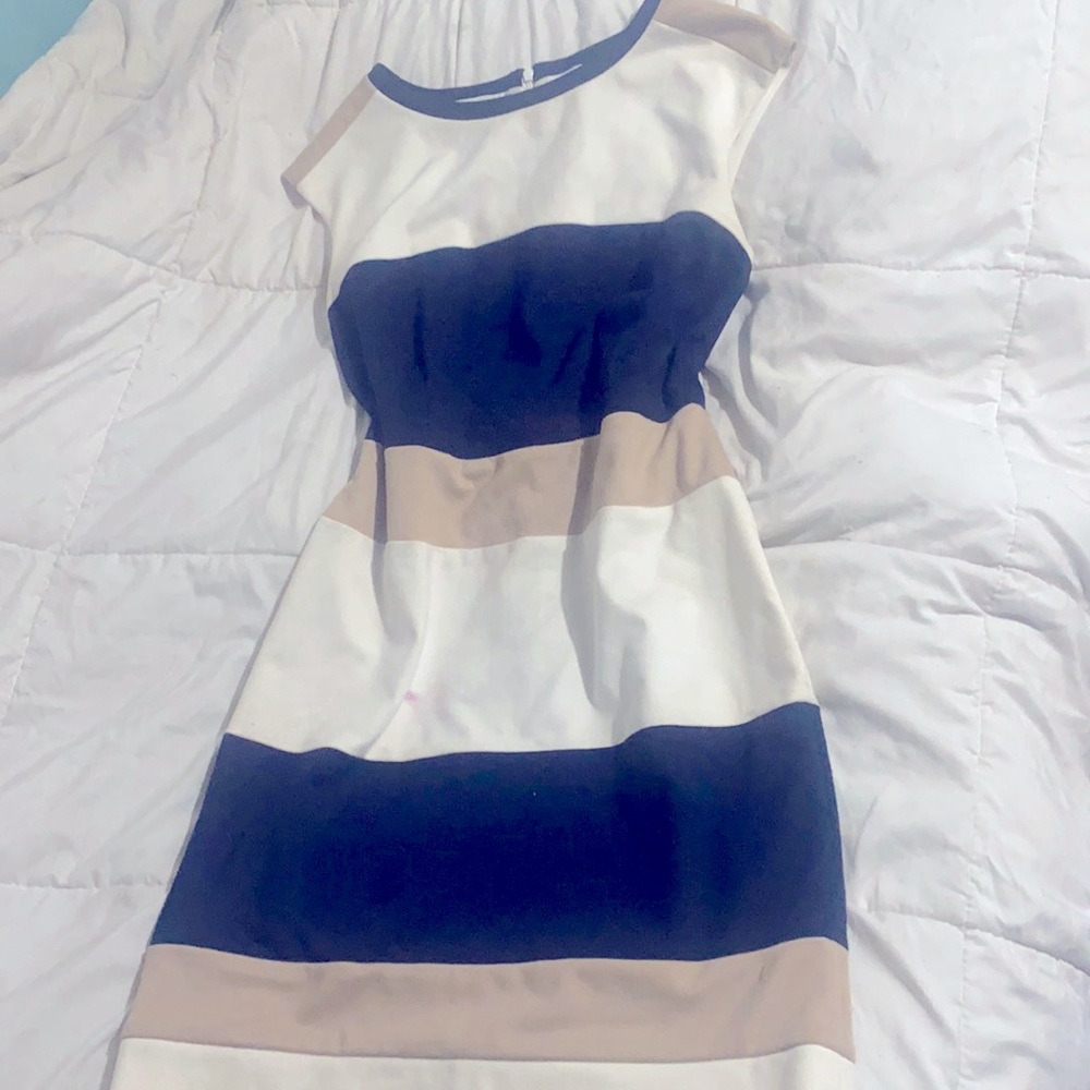 Great quality dress, inside is lined, good condition.